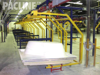 Timed curing accumulation on power and free conveyor system for large bathtubs.