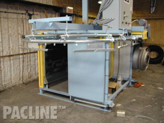 A compact conveyor for the painting of truck rims.