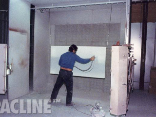 Conveying of kitchen cabinet panels from manufacturing through the finishing process and back to assembly.