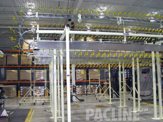 Buffer accumulation of automotive headliners, 4 over and under units, pneumatically indexed, coated carriers.