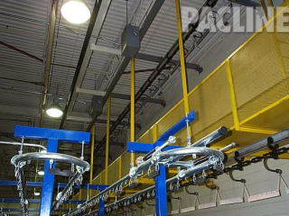 Buffer storage of paint racks with 9 inch radius curves, utilize a floor mounted overhead conveyor system.