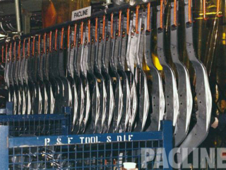 Manual over and under parts buffer loop for automotive frames. Transferring parts from work station to work station.