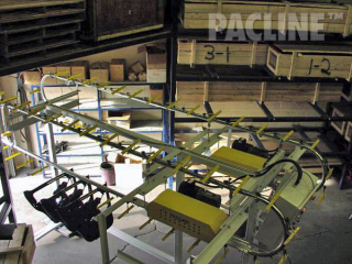 Powered, over and under loop for sequencing of automotive door panels onto assembly line.