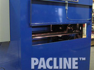 Front-view of vertical conveyor used for storage of plastic sheets, which are placed on the specialty made racks.