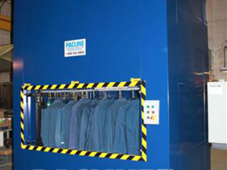 Vertical conveyors have many application uses, for example placing work uniforms in an automated storage system.