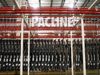 Accumulation of truck body panels for just in time sequencing using overhead power and free conveyor.