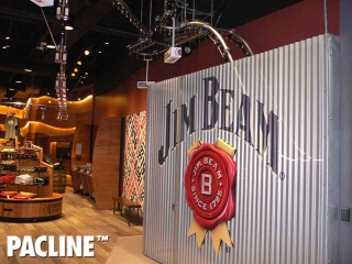Jim Beam Stillhouse uses a creative retail conveyor to produce a unique bottling display.