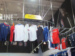 Garment handling conveyor from PACLINE can be used to store inventory and display clothing at the same time.