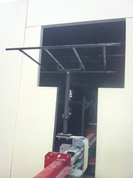Side mounted heavy duty conveyor with rotators