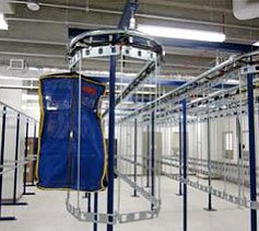 Single track, two tier garment conveyor system.