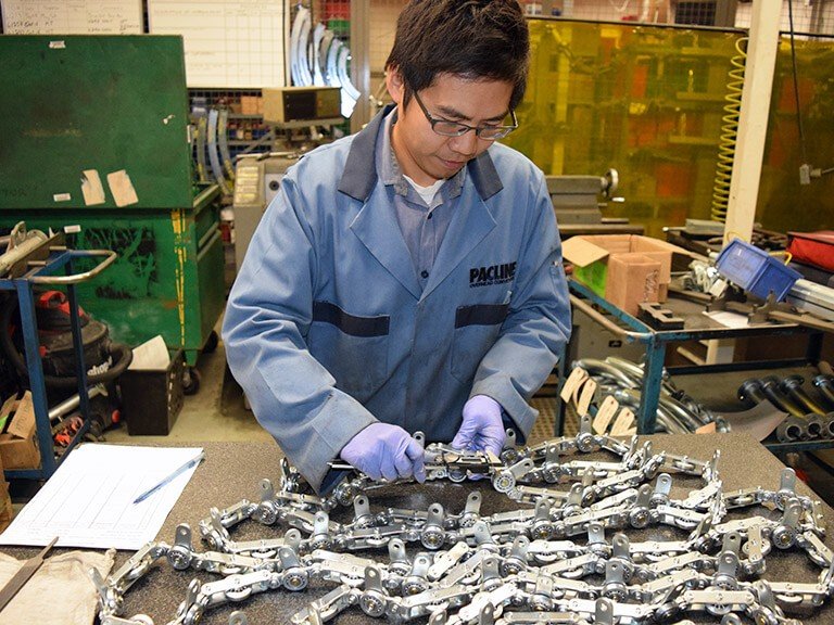 PACLINE always testing overhead conveyor chains for quality