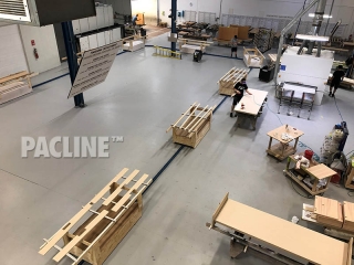 Towline conveyor for wood furniture finishing facility