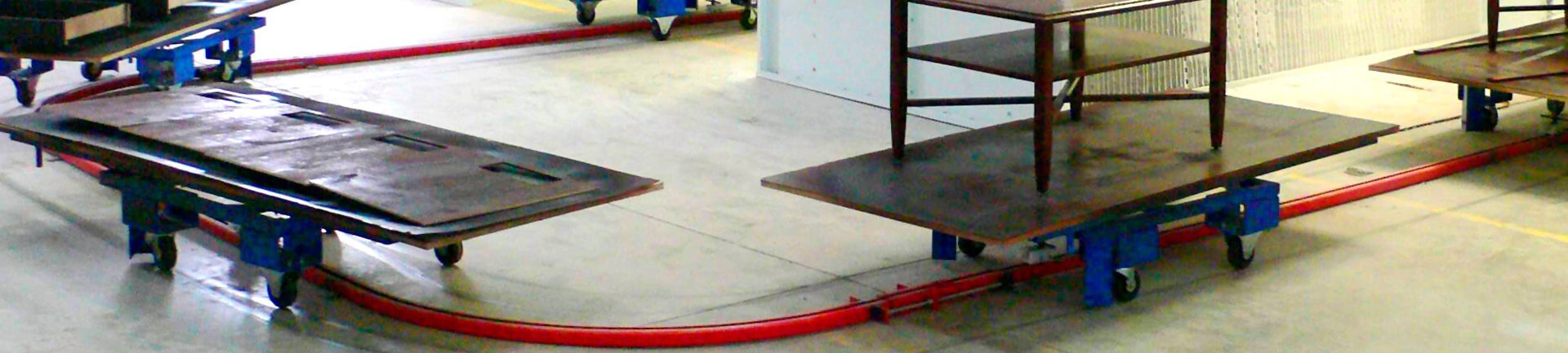 On floor or in floor towline conveyor system carts have rotating top platens