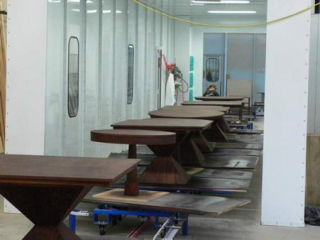 Cart tops are automatically rotated to allow close packing of carts in this paint line conveyor system.