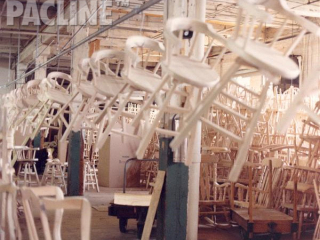 PAC-LINE™ overhead conveyor system designed to transport chairs/bar stools through furniture manufacturer.