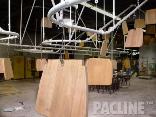 PACLINE&#039;s rotating carrier allows for easy access to all areas of wood part during finishing.