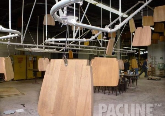 PACLINE&#039;s rotating carrier allows for easy access to all areas of wood part during finishing.