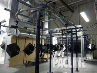 High Quality Wood Speaker Manufacturer uses the PAC-LINE™ enclosed track conveyor for their Wet Spray application.