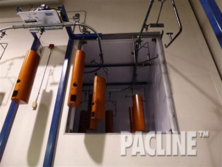 High Quality Wood Speakers enter a curing oven via The PAC-LINE™ enclosed track overhead conveyor.