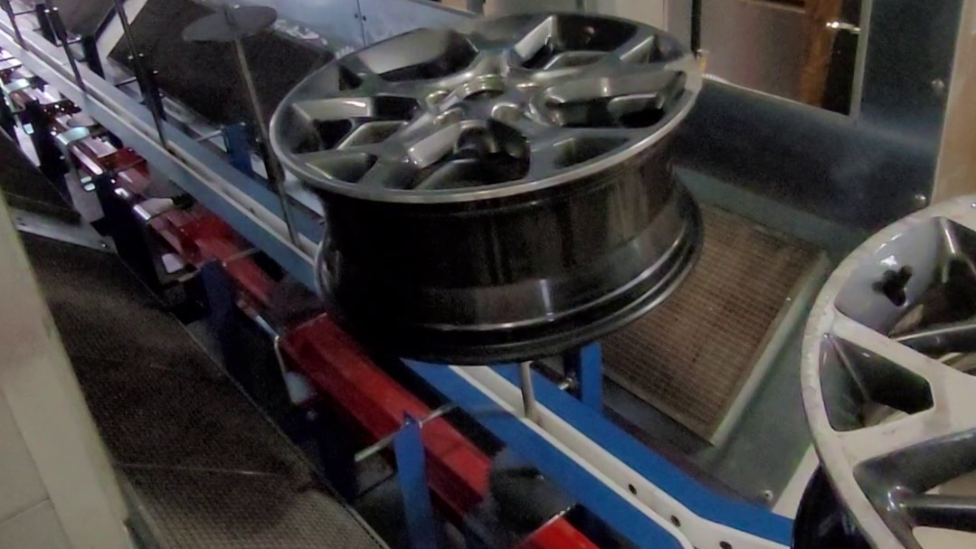 rim-finishing-conveyor-rims-in-oven outdoor art installation conveyor system